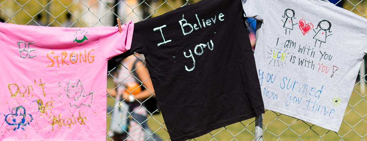 Three t-shirts with empowering messages from the clothesline project.
